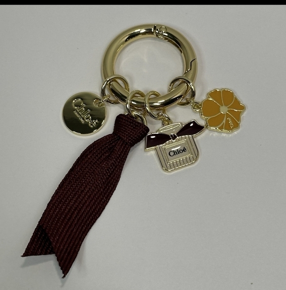 Chloé Gold-Tone Keyring with Burgundy Ribbon and Yellow Enamel Flower